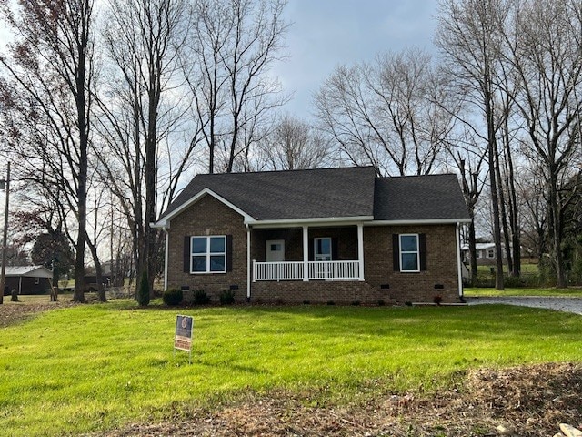 ranch-style house with a front lawn