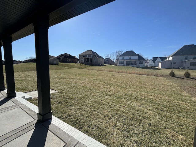 view of yard featuring a residential view and fence