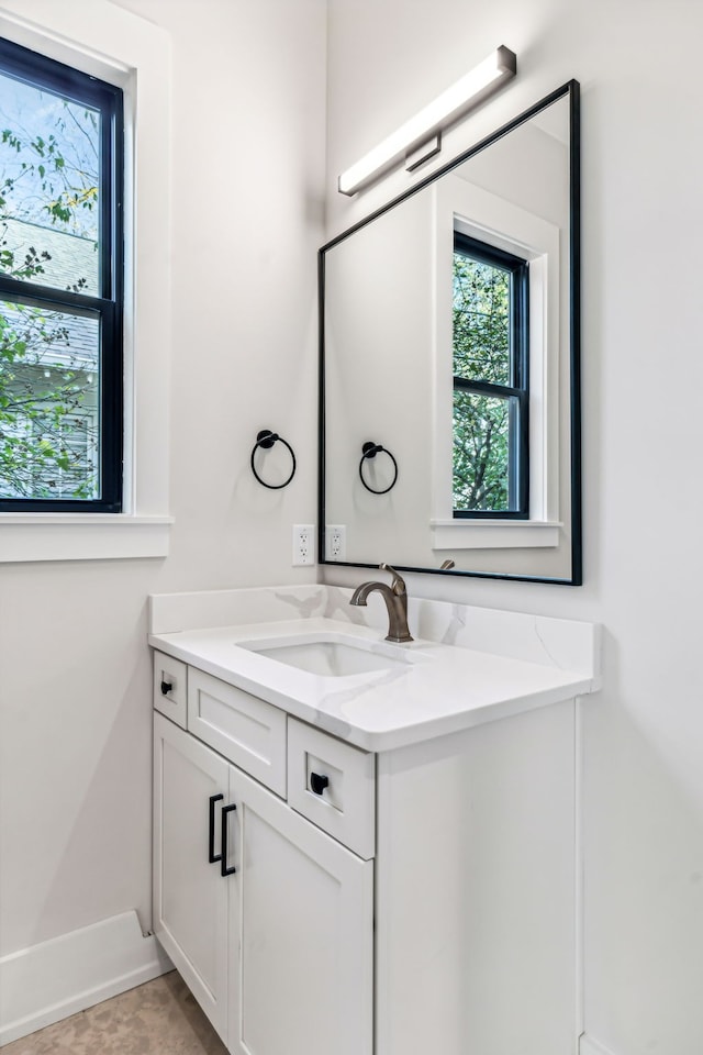 bathroom with tile patterned floors and vanity