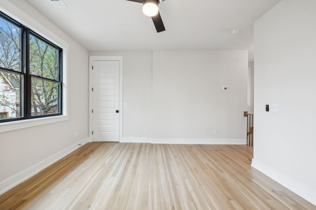 spare room with ceiling fan and light hardwood / wood-style flooring