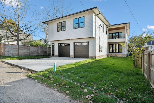 view of property exterior with a lawn and a garage