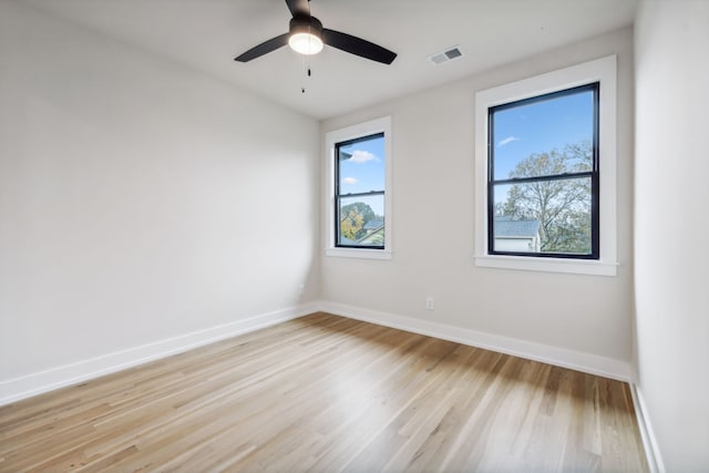 spare room featuring light hardwood / wood-style flooring and ceiling fan