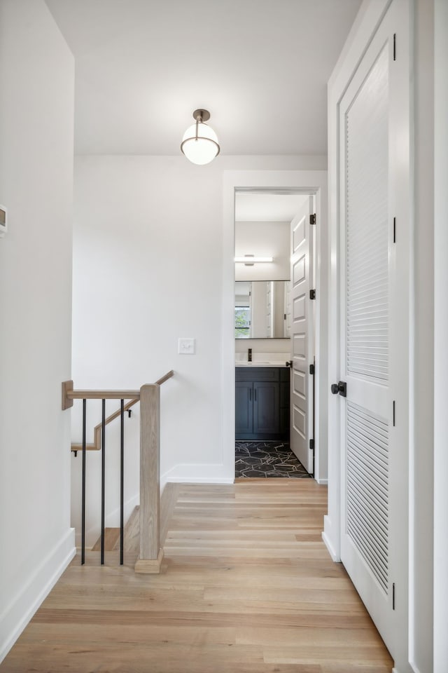 hall with light hardwood / wood-style flooring