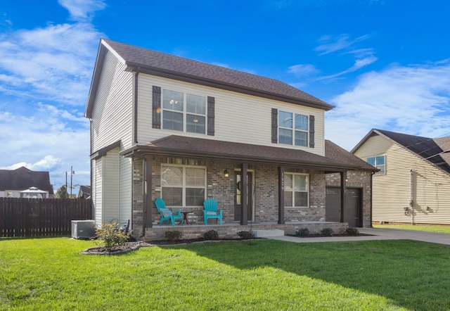 view of front of house with central AC, a porch, and a front yard