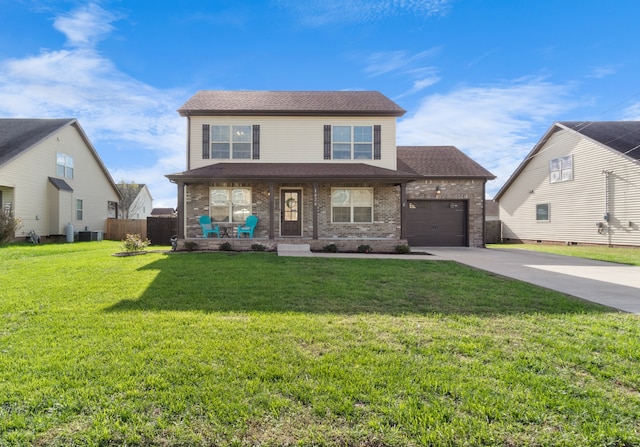 view of front facade featuring a front lawn, a porch, and a garage