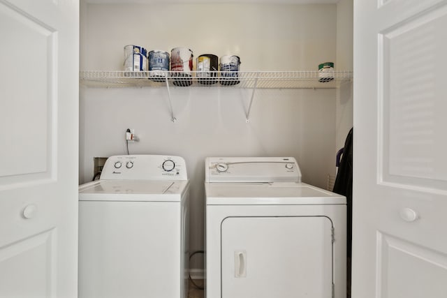 laundry room featuring washing machine and clothes dryer