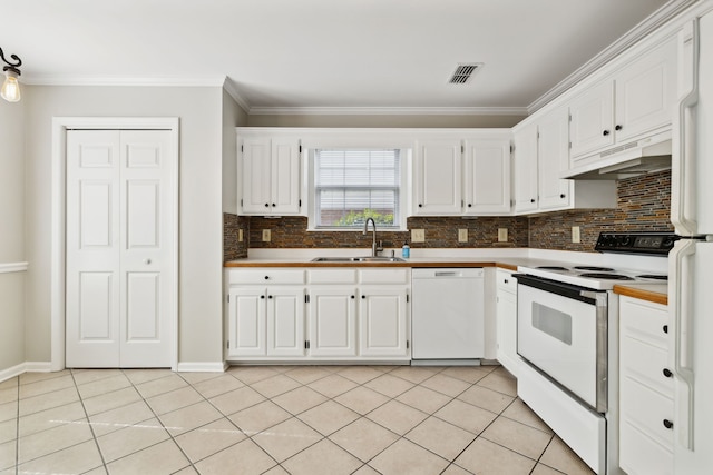 kitchen with sink, white cabinets, and white appliances