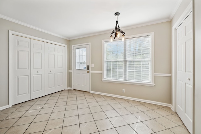 interior space with crown molding, light tile patterned floors, and a notable chandelier