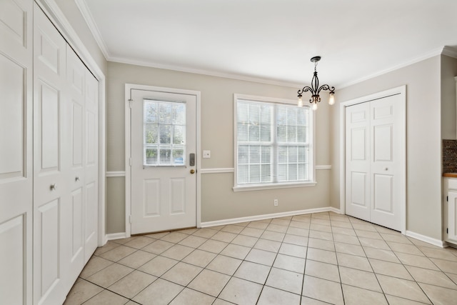 doorway with ornamental molding, light tile patterned floors, and a chandelier