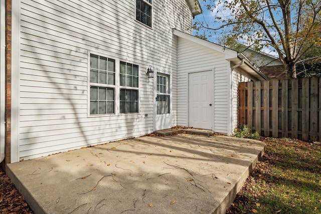 property entrance featuring a patio