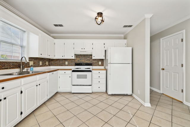 kitchen featuring crown molding, sink, white cabinets, and white appliances