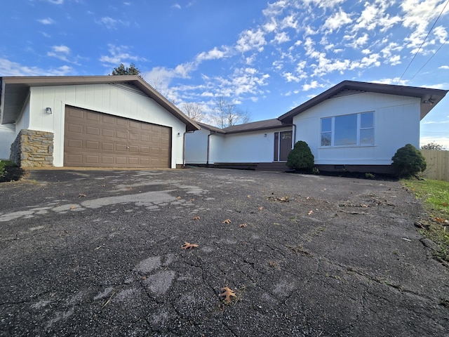 ranch-style house featuring a garage