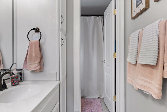 bathroom with sink and curtained shower