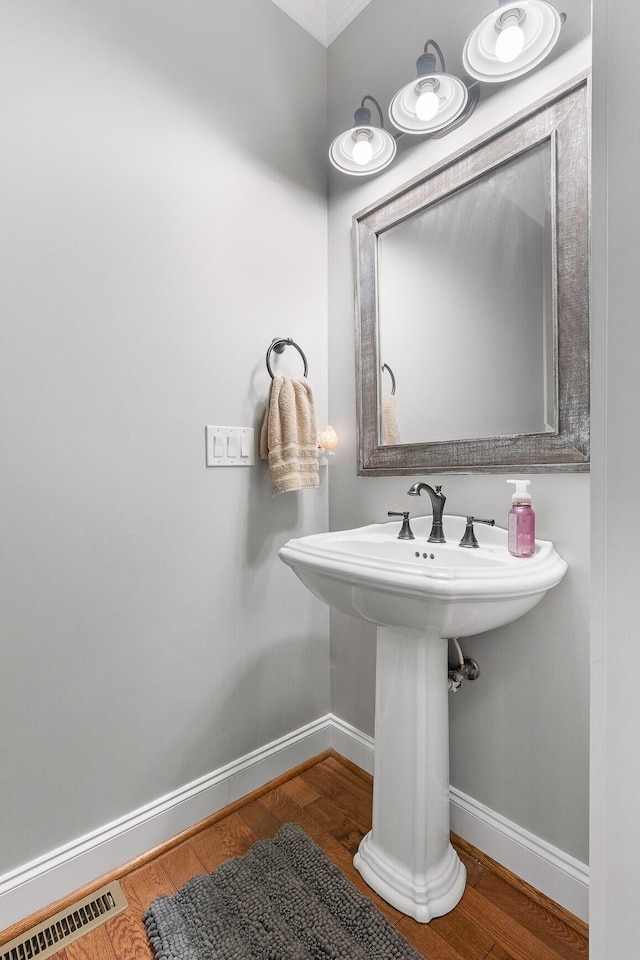 bathroom with wood-type flooring