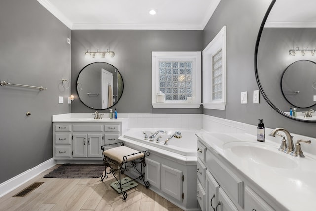 bathroom featuring hardwood / wood-style floors, vanity, crown molding, and a bath