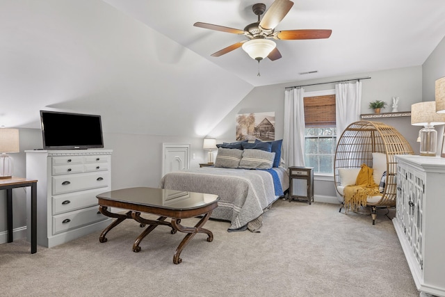 bedroom with ceiling fan, light colored carpet, and lofted ceiling