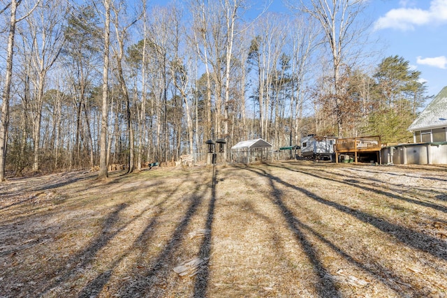 view of yard featuring a deck