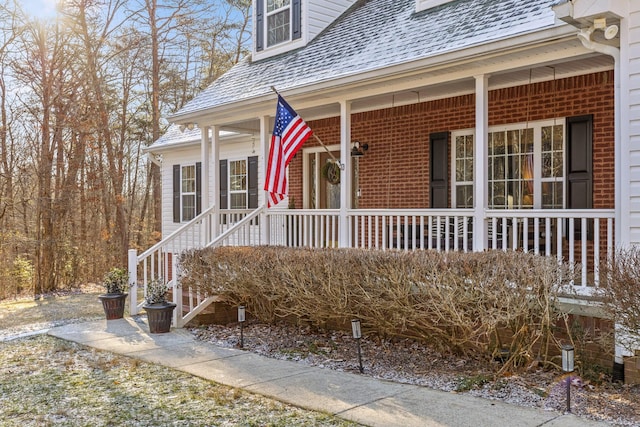 entrance to property with a porch