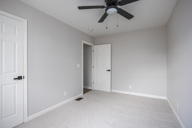 carpeted empty room with ceiling fan