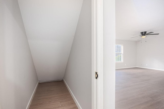 interior space featuring hardwood / wood-style floors and vaulted ceiling