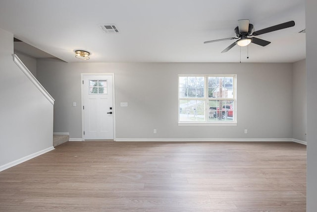 entrance foyer with ceiling fan and light hardwood / wood-style floors