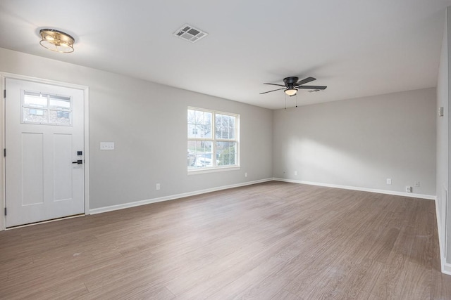 foyer with light hardwood / wood-style flooring and ceiling fan