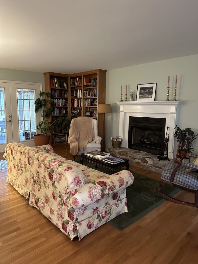 living room with a fireplace and hardwood / wood-style flooring