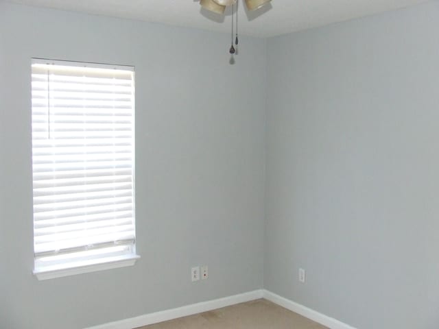 unfurnished room with ceiling fan