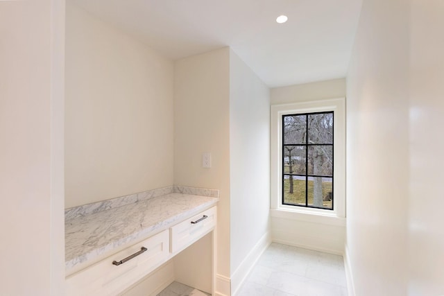 bathroom featuring recessed lighting, marble finish floor, and baseboards