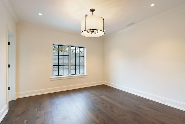 empty room with crown molding, baseboards, visible vents, and dark wood-style flooring