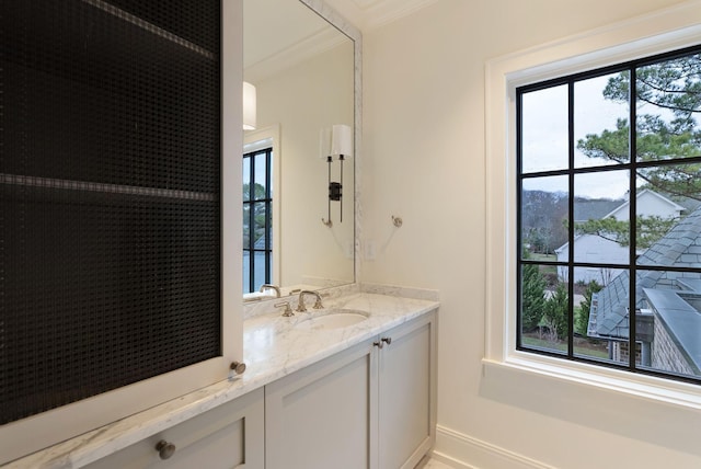 bathroom featuring vanity and crown molding