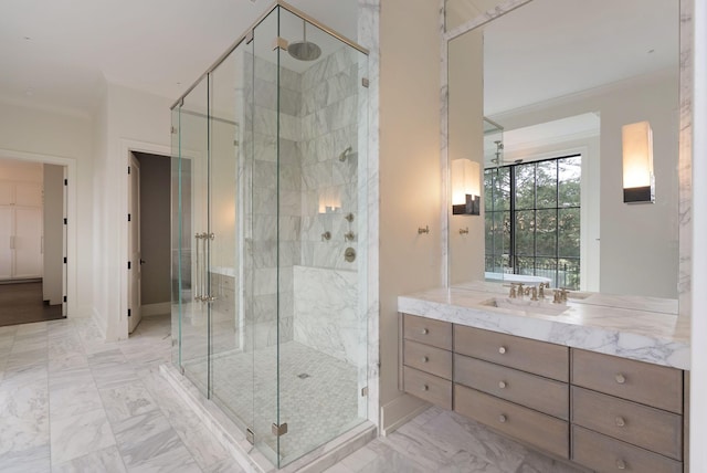 bathroom featuring baseboards, vanity, marble finish floor, and a shower stall