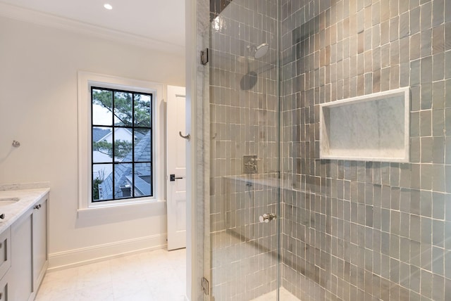 bathroom featuring vanity, baseboards, recessed lighting, a stall shower, and crown molding