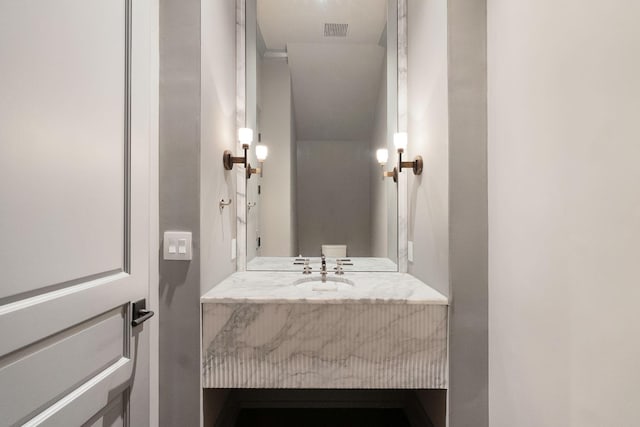 bathroom with visible vents and vanity