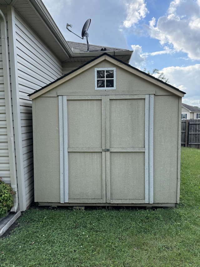 view of outbuilding with a lawn