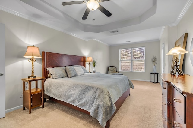 bedroom with light carpet, a raised ceiling, ceiling fan, and crown molding