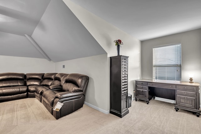 living room featuring light colored carpet and vaulted ceiling