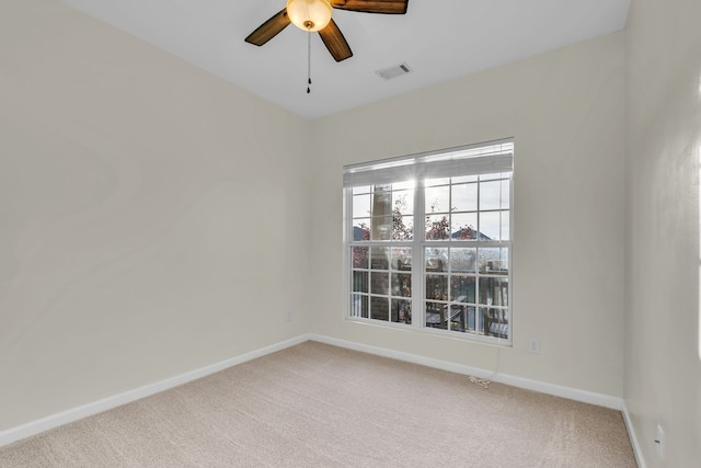 carpeted empty room with ceiling fan