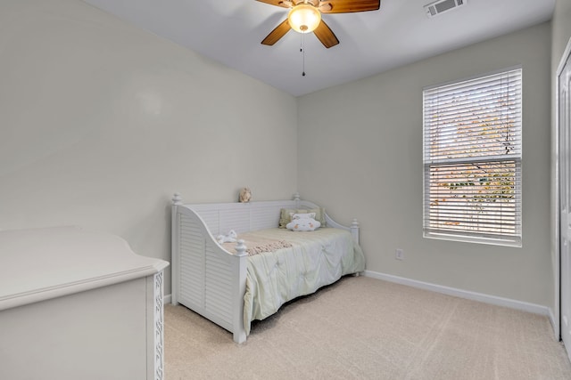 bedroom with ceiling fan and light colored carpet