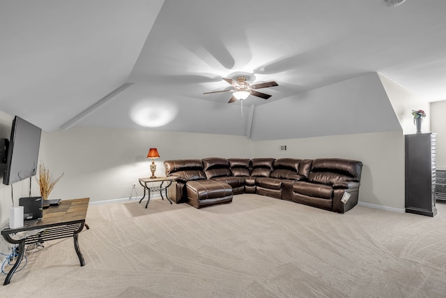 living room featuring ceiling fan, lofted ceiling, and light carpet