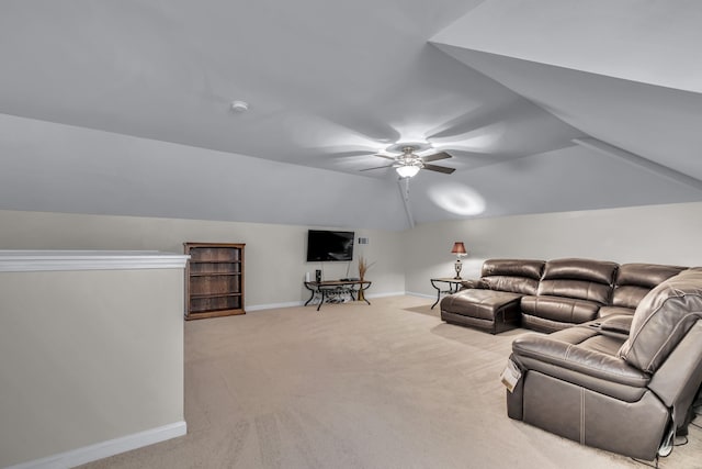 carpeted living room with ceiling fan and lofted ceiling