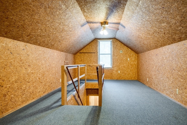 additional living space featuring ceiling fan, carpet, and vaulted ceiling