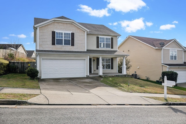 front of property featuring a front yard, a garage, central AC unit, and covered porch