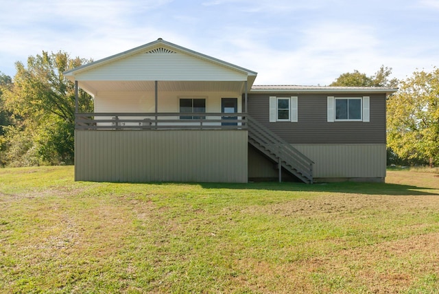 back of house featuring a yard