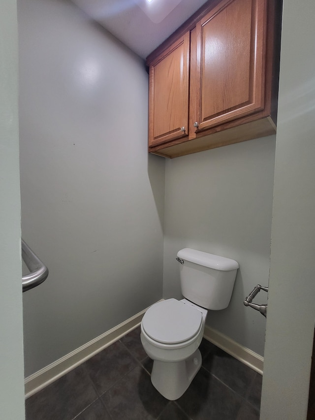 bathroom with tile patterned floors and toilet