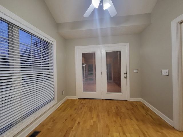 doorway to outside featuring french doors, light wood-type flooring, and ceiling fan