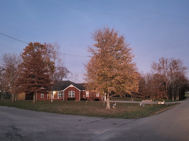 view of front of property with a yard