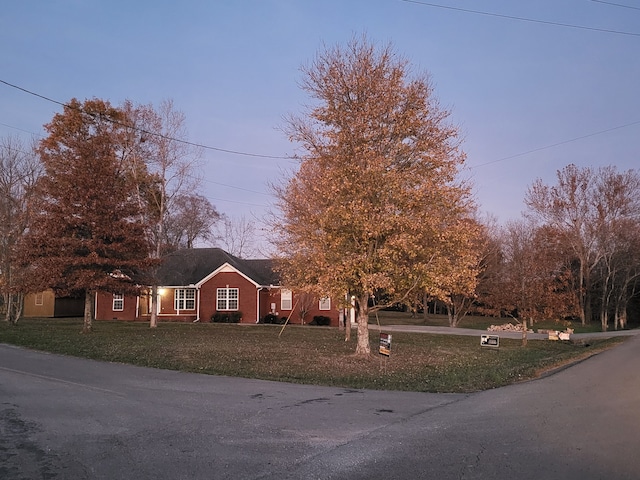 view of front of property with a lawn