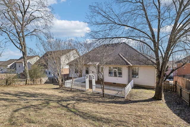 back of property featuring a yard