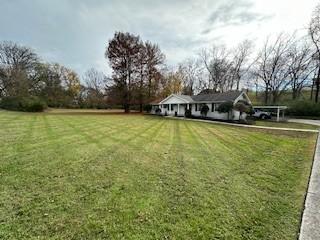 1337 Vanderbilt Rd, Mount Juliet, TN 37122 - view of grassy yard featuring a carport